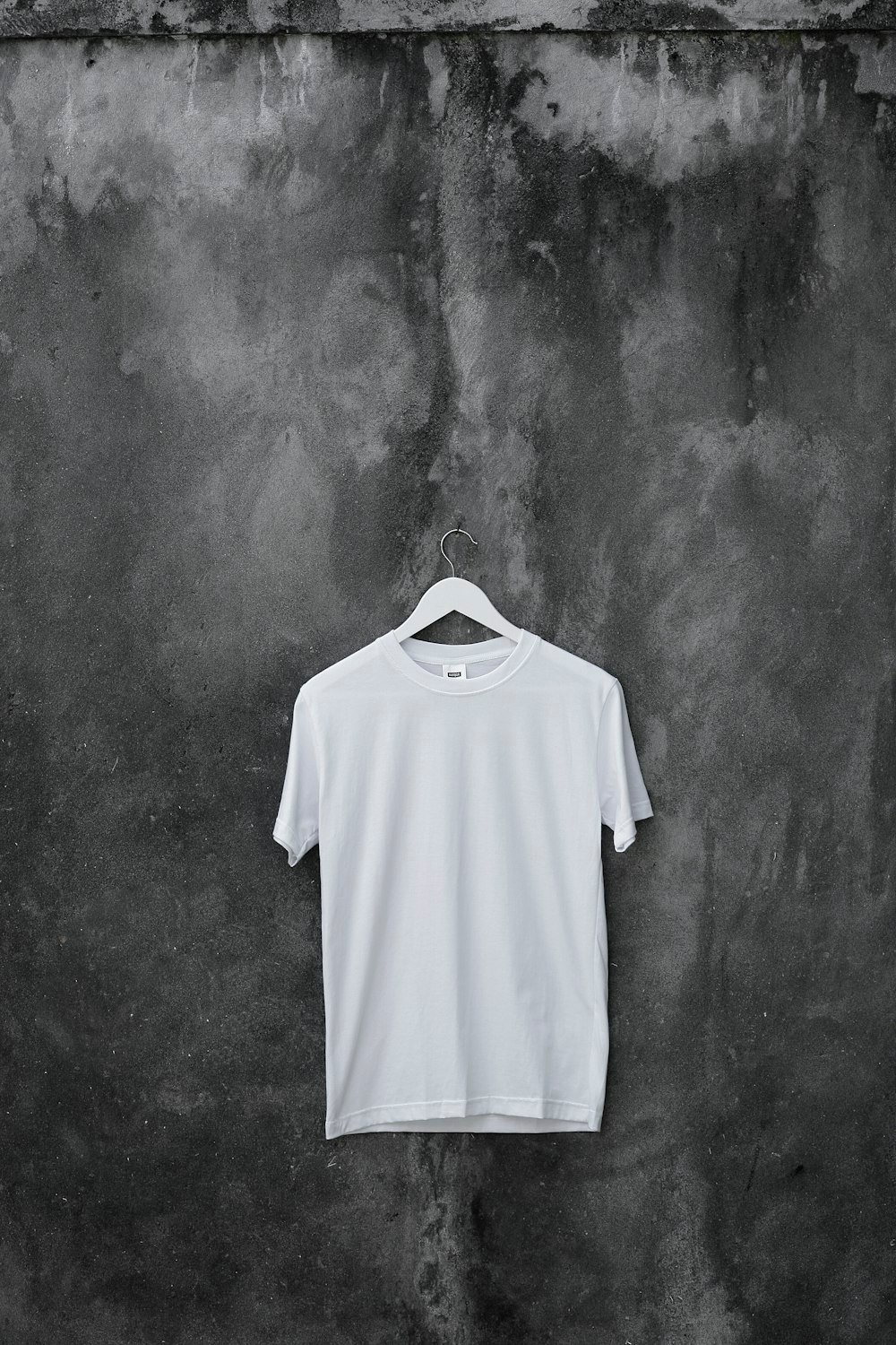 Tailor hand-stitching premium garment in workshop