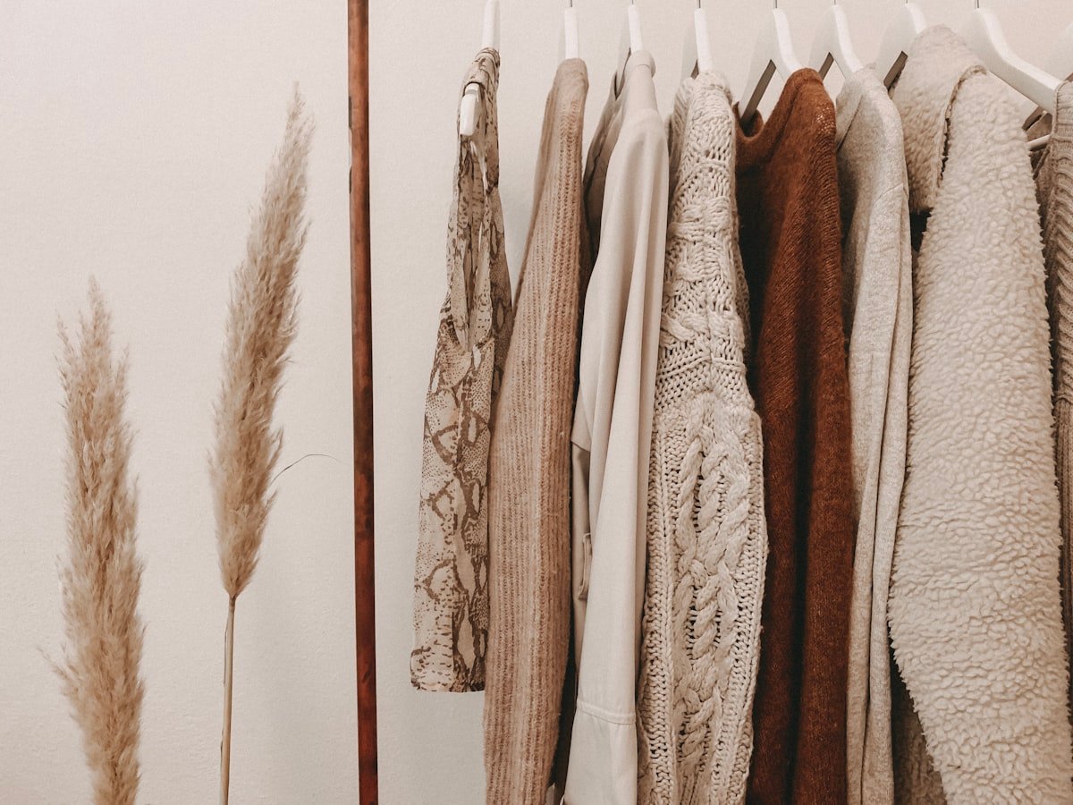 Fashion designer sketching garment collection in atelier